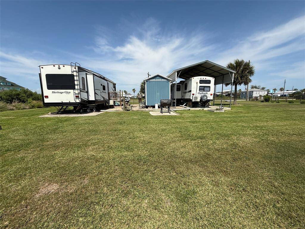 Two RV ports and a storage unit for laundry, washer/dryer convey with purchase.
