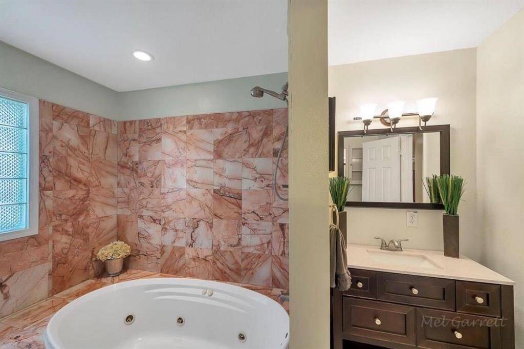 Large Garden Jacuzzi tub with shower.
