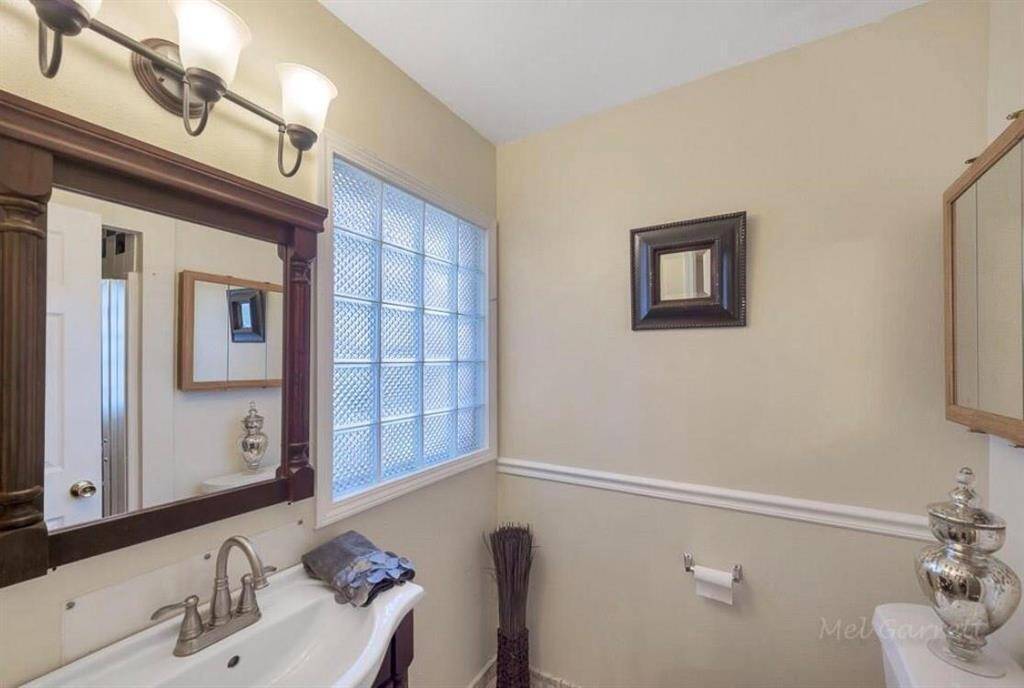Bathroom with standing shower inside the Bedroom