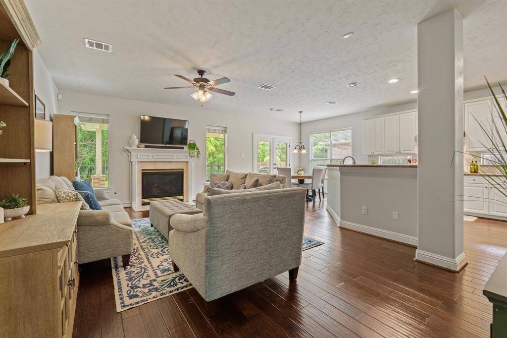 A spacious half-bath with a stylish vanity and updated finishes is tucked between the front living areas and family room.