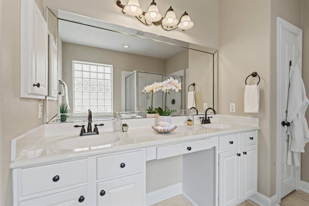 Pamper yourself in a bath that offers dual vanities, a soaking tub, walk-in shower, water closet, and large closet.