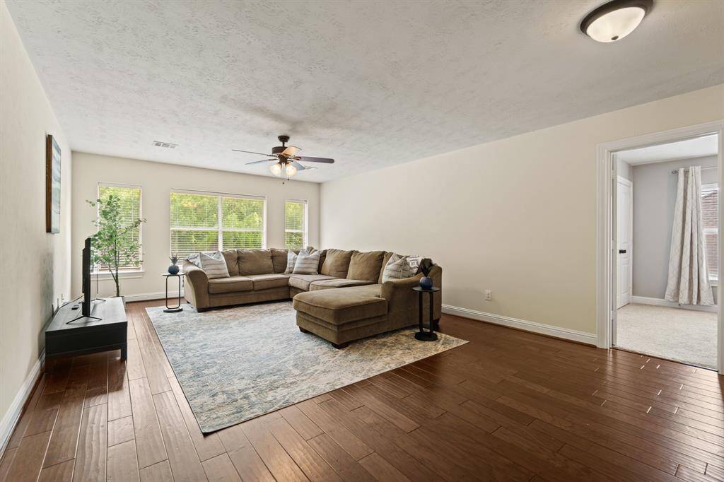 With gorgeous floors and backyard views, this upstairs flex space is both functional and fabulous.
