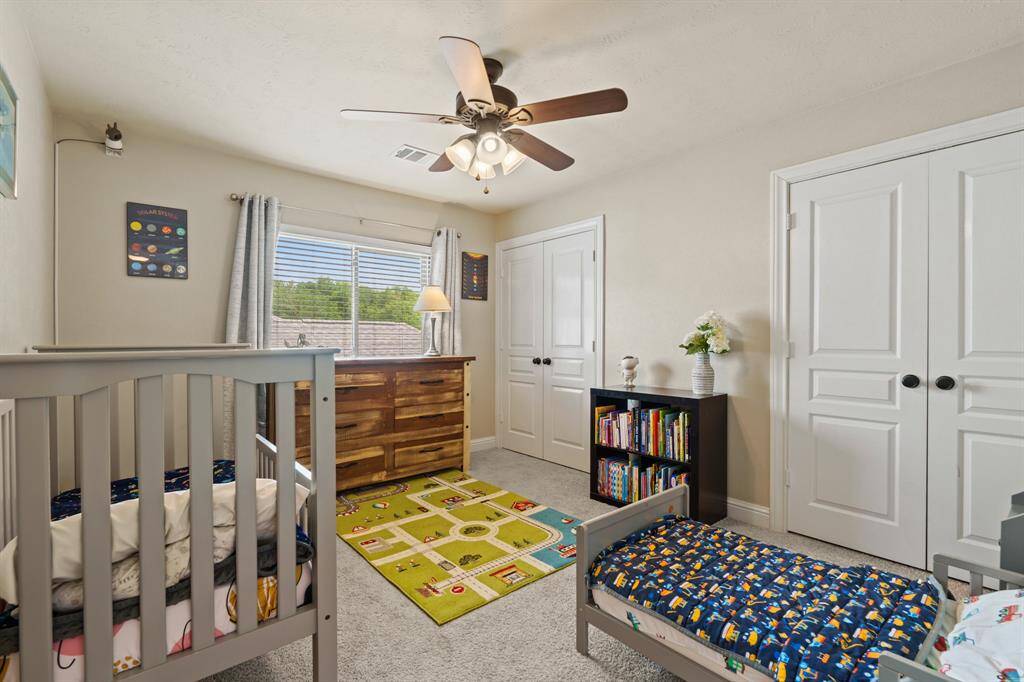 Bedroom #3 is equally charming with soft paint, ceiling fan, and not one, but two closets!