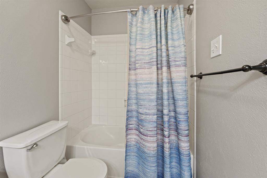The private ensuite bath for bedroom #4 is stylish and functional—great for guests or multigenerational living.