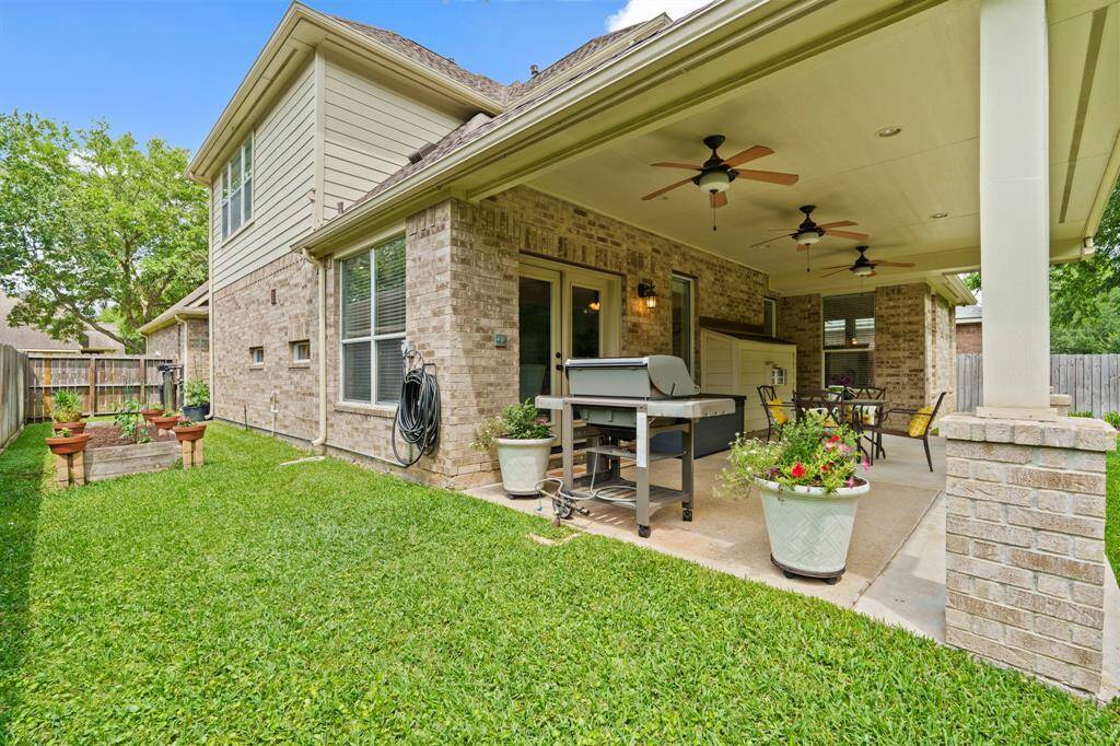 The lot allows for dual side yards—this one currently features a peaceful, private garden.