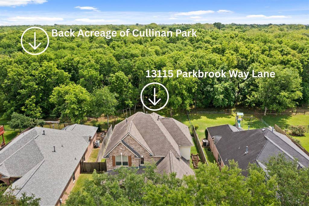 The backyard is a hidden gem—lush and private, backing to the wooded serenity of Cullinan Park.