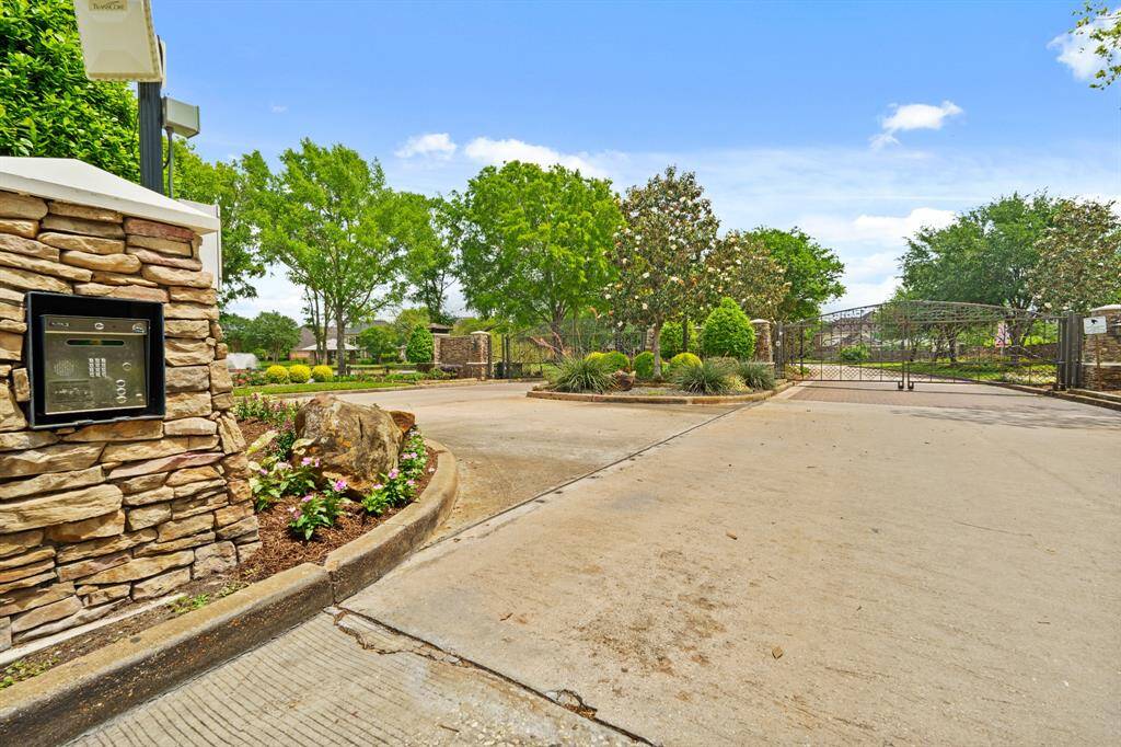 Another look at the secure gated entrance—providing peace of mind and a grand welcome home to your new home at 13115 Parkbrook Way Lane!