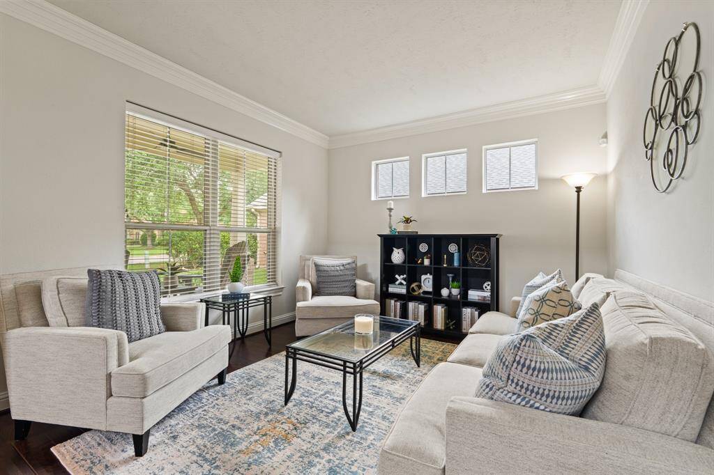 Step inside to hand-scraped hardwood floors that flow throughout the main living spaces—absolutely stunning!