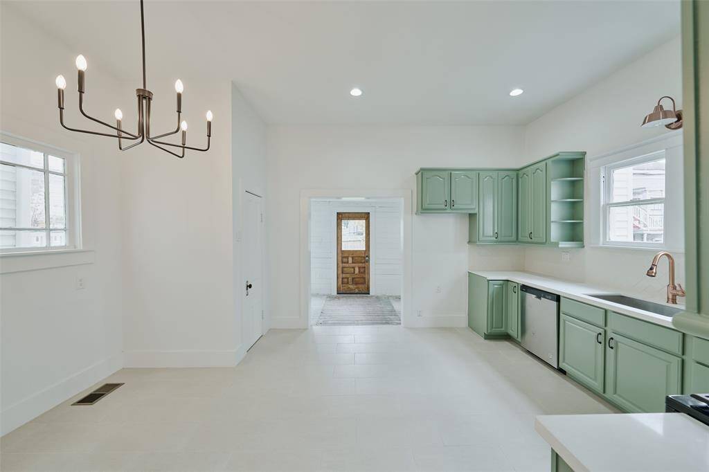 Spacious back secondary bedroom with a view towards the inviting landing area.