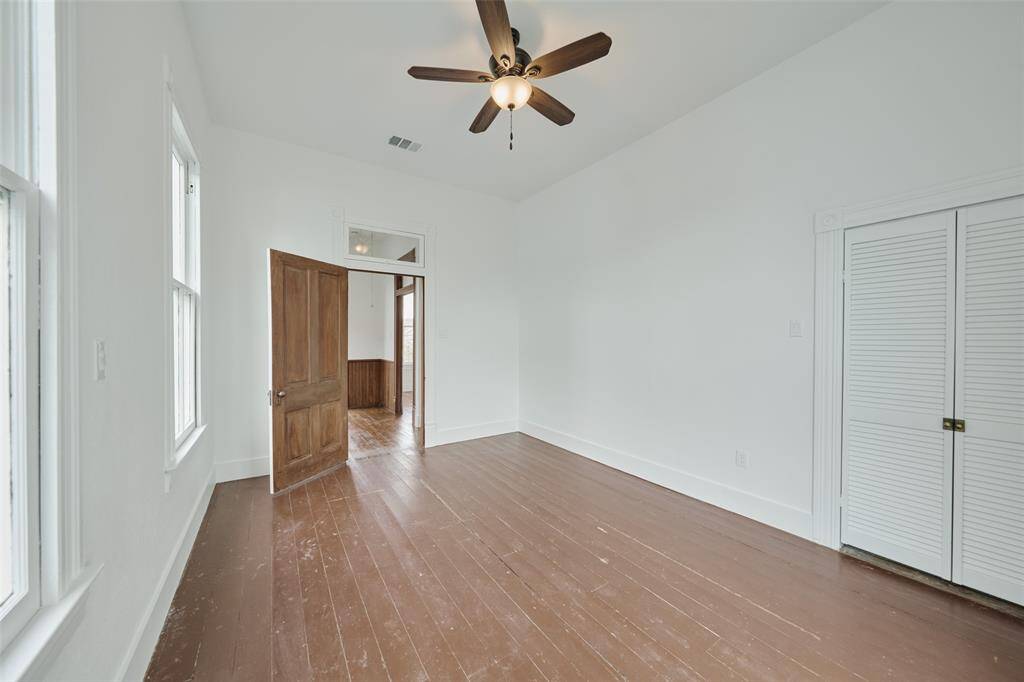 Expansive backyard with endless possibilities including a lush courtyard, extra parking, a garage apartment, or a swimming pool.