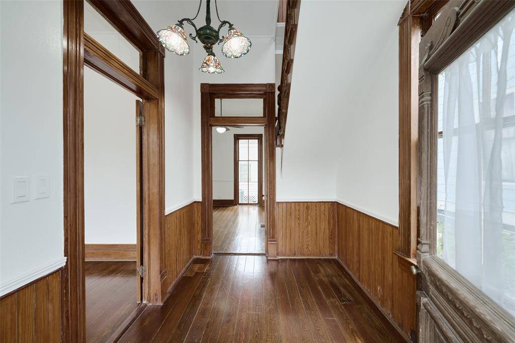 Elegant Pocket Door transition from the living room to the spacious dining area.