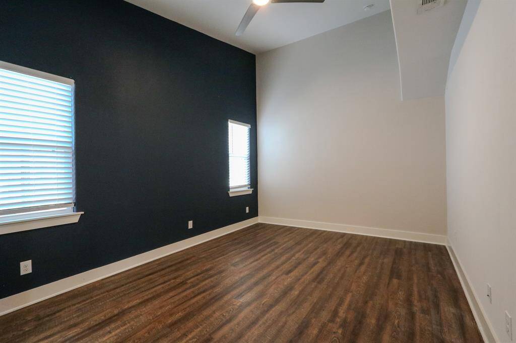 Primary bedroom with custom painting.