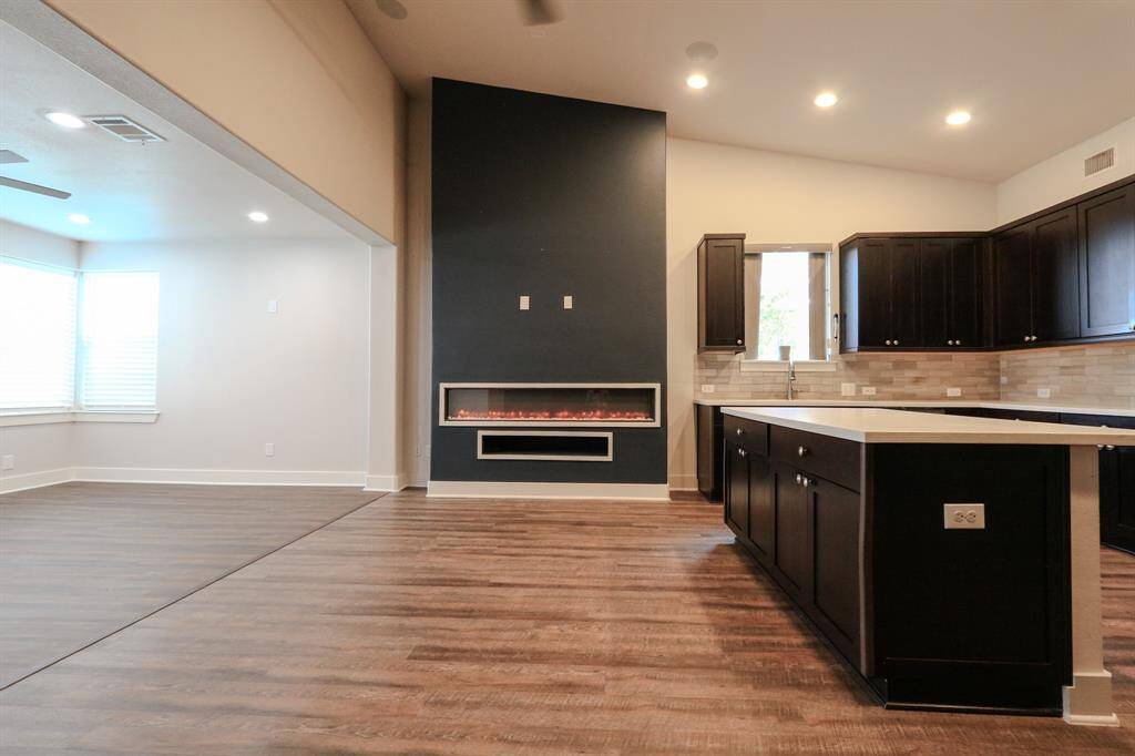 Multi-functioning electric fireplace with remote control.