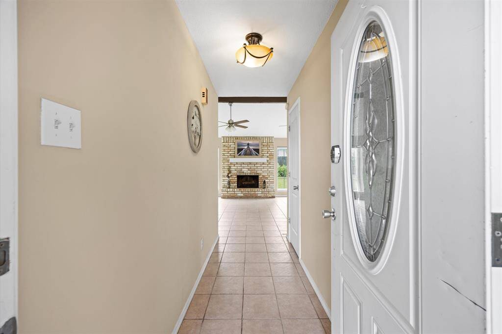 Entryway leads to the spacious living area.