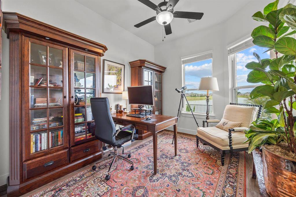 This serene study offers a perfect workspace with expansive windows showcasing breathtaking views.