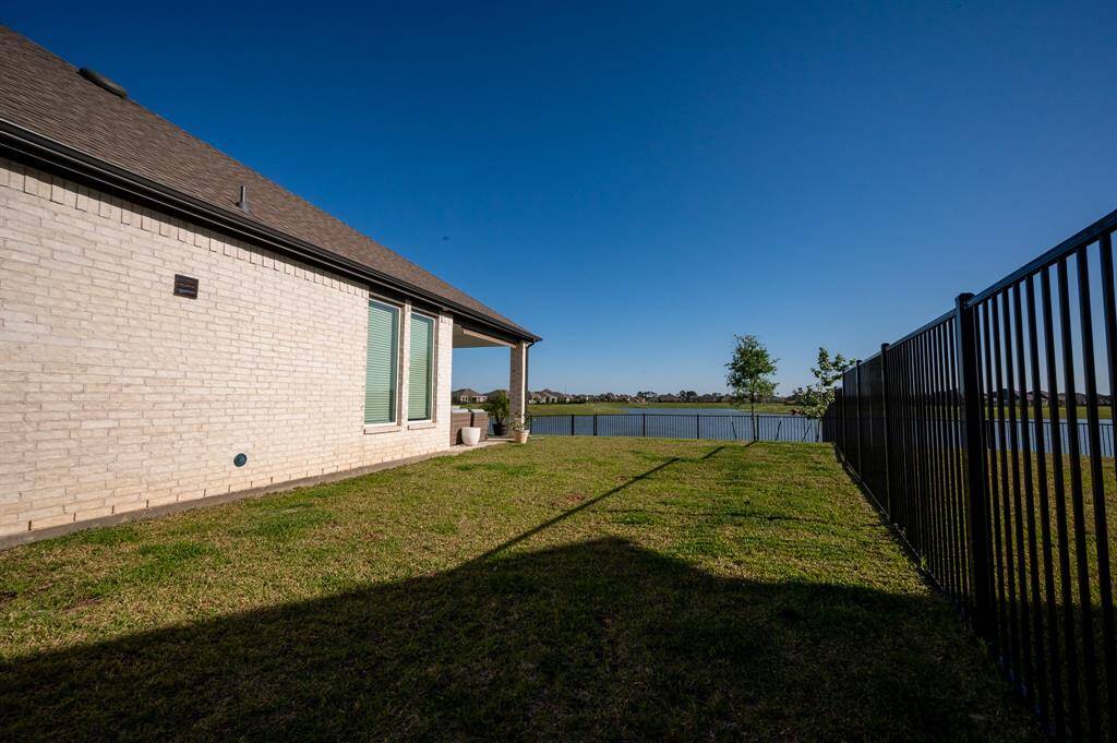 Expansive side yard perfect for a storage shed or additional outdoor projects.
