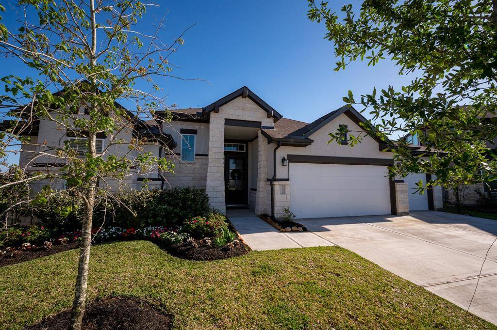 This stunning home features a spacious three-car garage and additional driveway space, nestled on a serene cul-de-sac. A must-see!