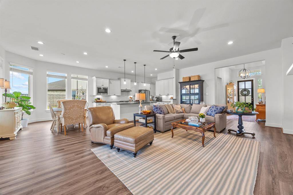Abundant natural light and neutral tones enhance this stunning open floor plan.