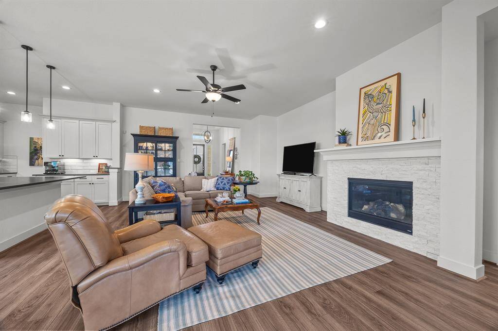 Cozy gas log fireplace enhances this inviting home.