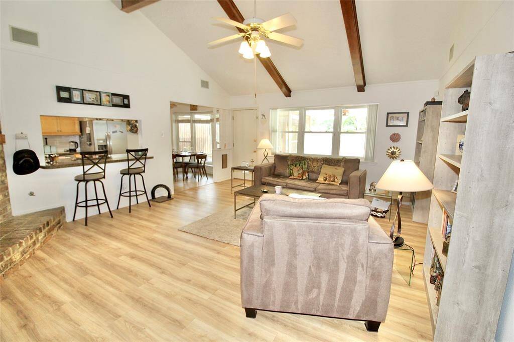 Large living area with breakfast bar and cozy fireplace