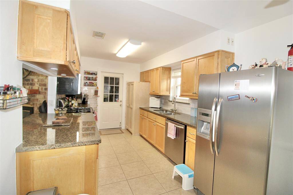 view of the kitchen, refrigerator stays