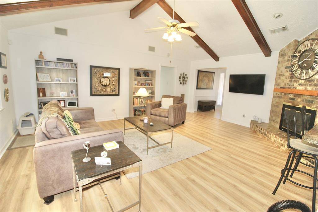 Another view of living area and tall ceilings