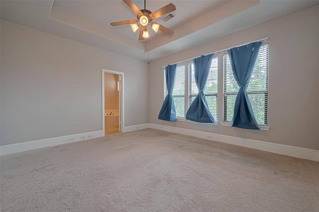 Large primary bedroom located on the second floor with easy access to the kitchen and living room.