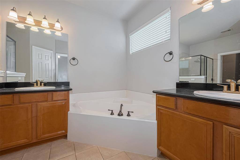En suite bath includes double vanity’s, separate shower and soaking tub as well as a great walk-in closet.