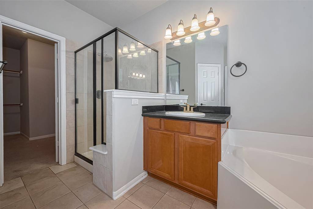 Separate shower and large primary closet.