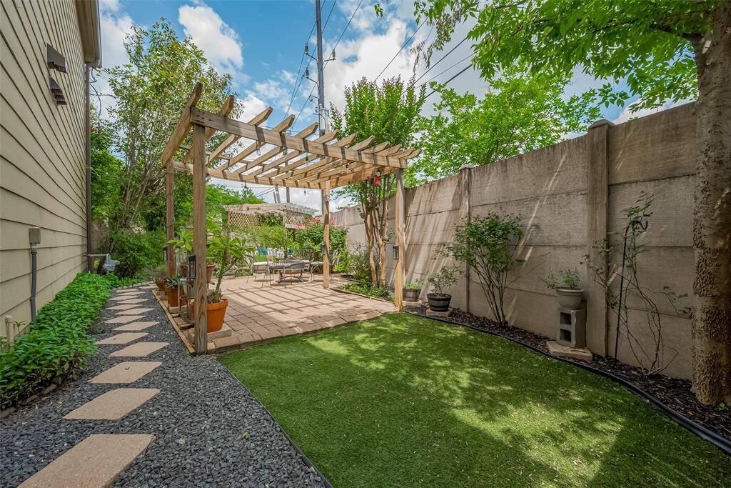 Large backyard oasis, well thought out design with a turfed area, two pergolas, lots of room for plants and multiple seating areas.