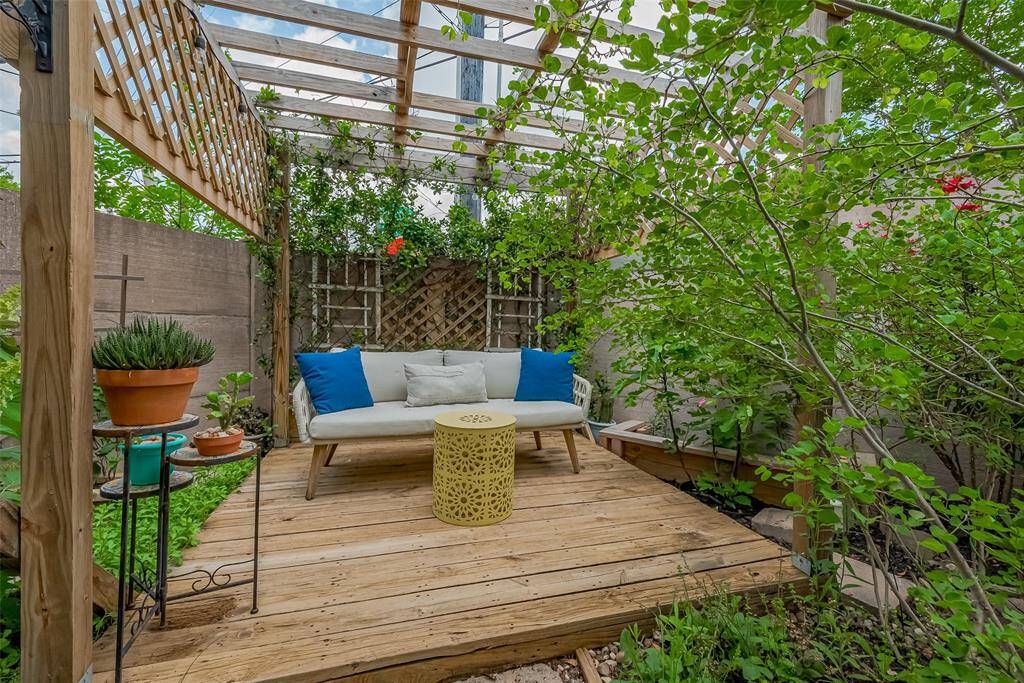 One of the outdoor seating areas surrounded by beautiful plants and trees!