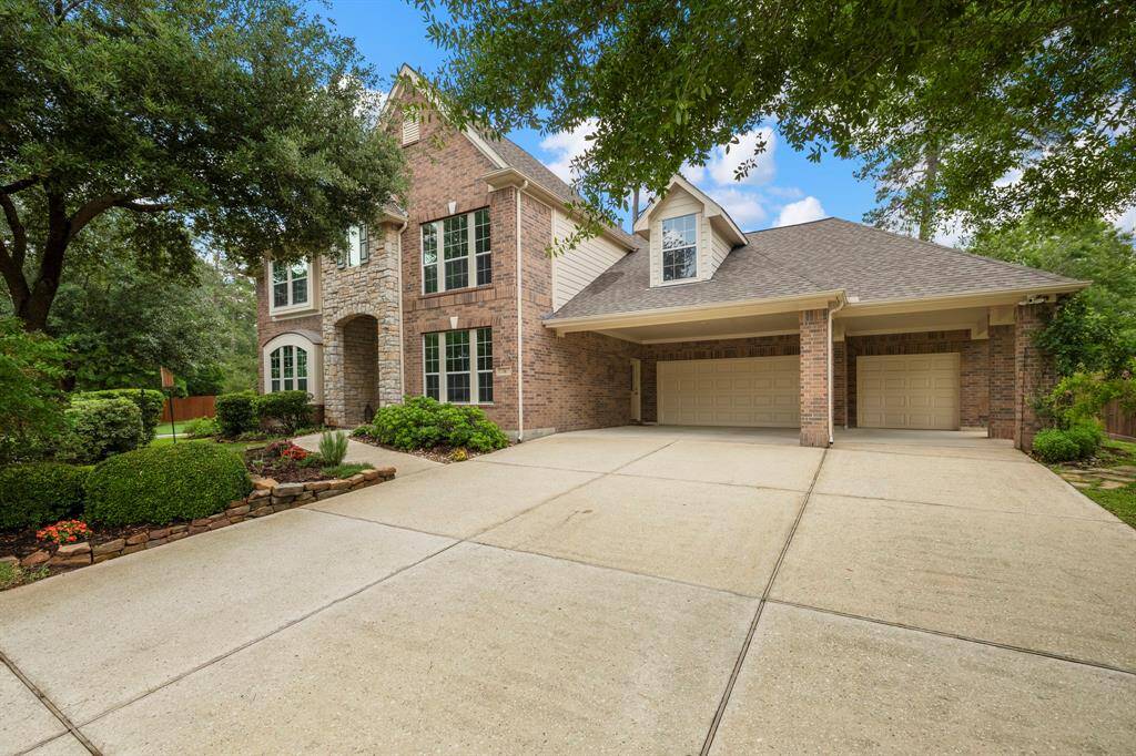 Coveted full 3 car across garage plus 3 car porte cochere and wide driveway simplifying multi vehicle access.