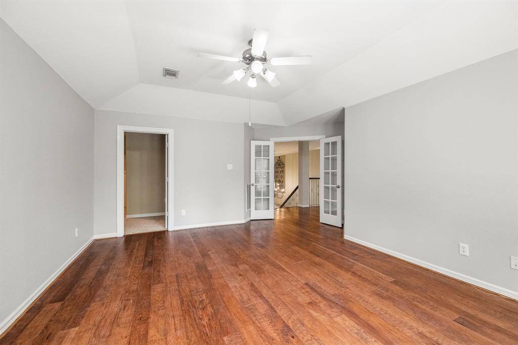 The gameroom also features french doors and an opening to a flex space that can be an additional gameroom, media room or air-conditioned storage.