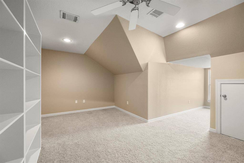 Versatile upstairs flex room ideal for a media room, second gameroom, or climate-controlled storage.
