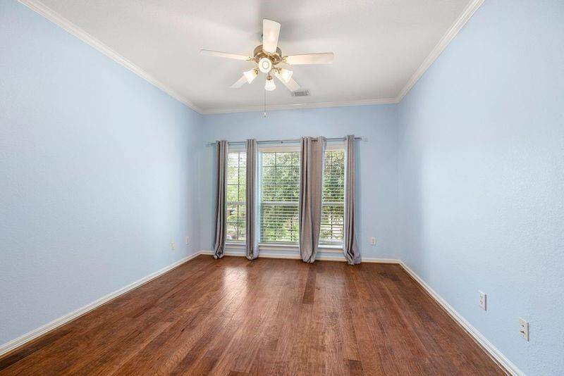Third bedroom upstairs has ample natural light and also has a large walk-in closet.