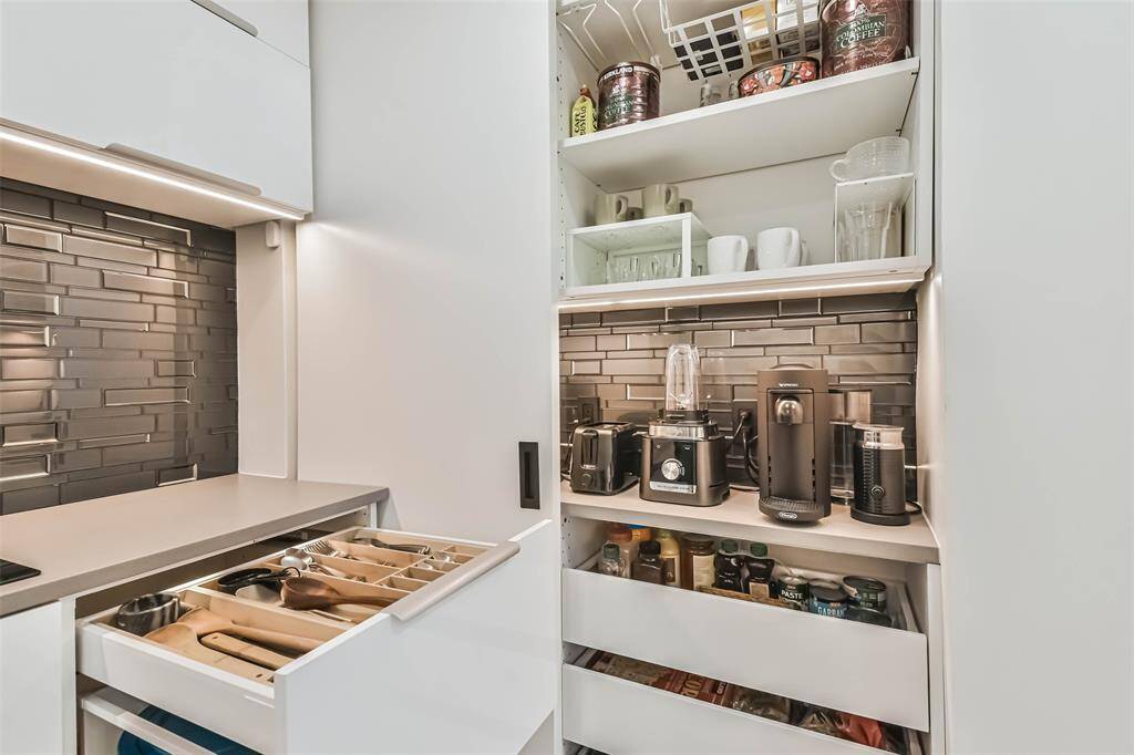 The pantry includes a complete coffee bar and appliance nook.  Every space has been cleverly utilized as evidenced by the compartmentalized top drawer.