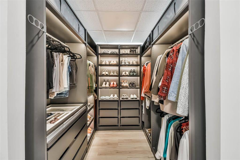The primary closet has pull out drawers for shoes, jewelry and additional accessories.