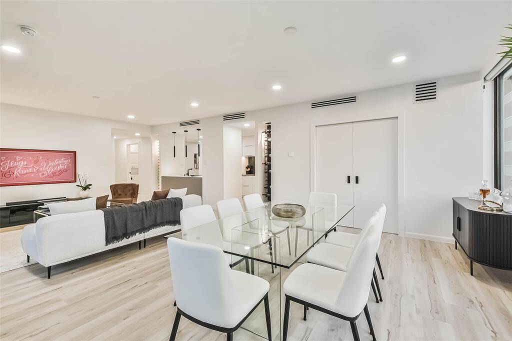 Two decorative insets in the living/dining area can store up to 108 bottles of wine.  Through the double doors is amazing flex space.