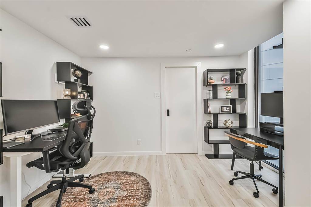 A double set of  doors opens to a separate study or third bedroom large enough for a queen bed.