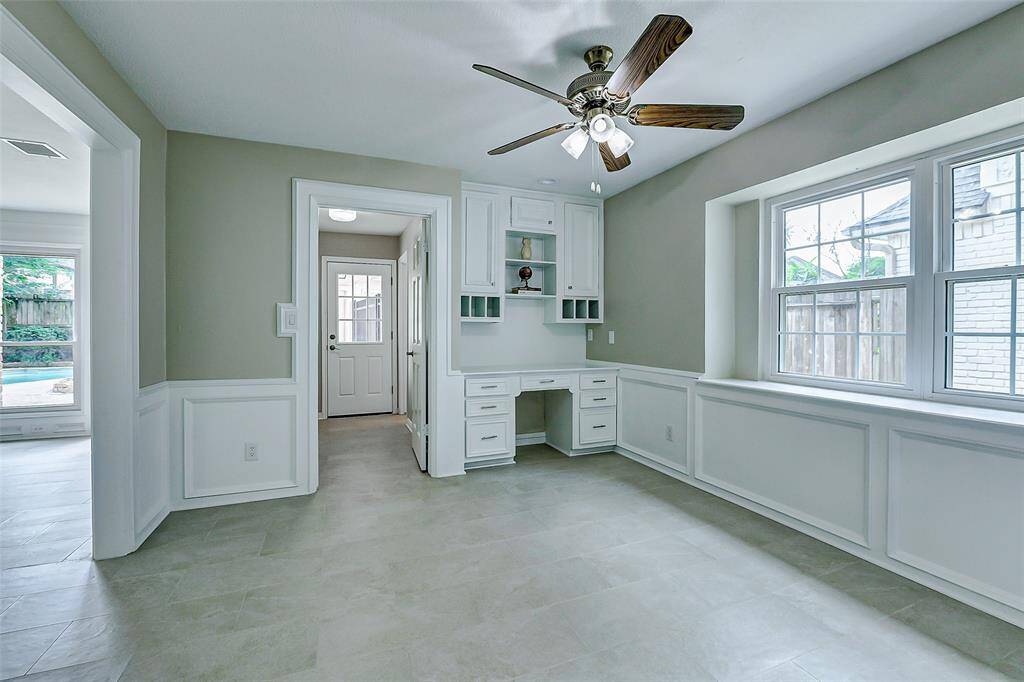 Spacious eat-in kitchen with a convenient built-in desk.