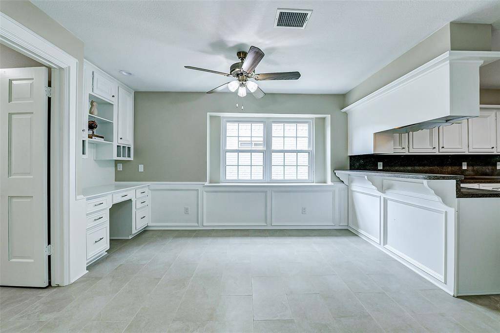 Freshly painted trim gives the breakfast area charm.