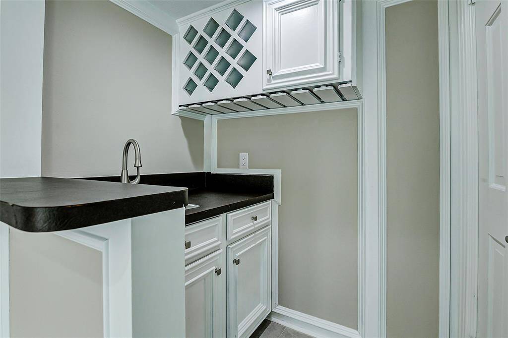 Enjoy the convenience of a stylish wet bar, perfect for entertaining guests.