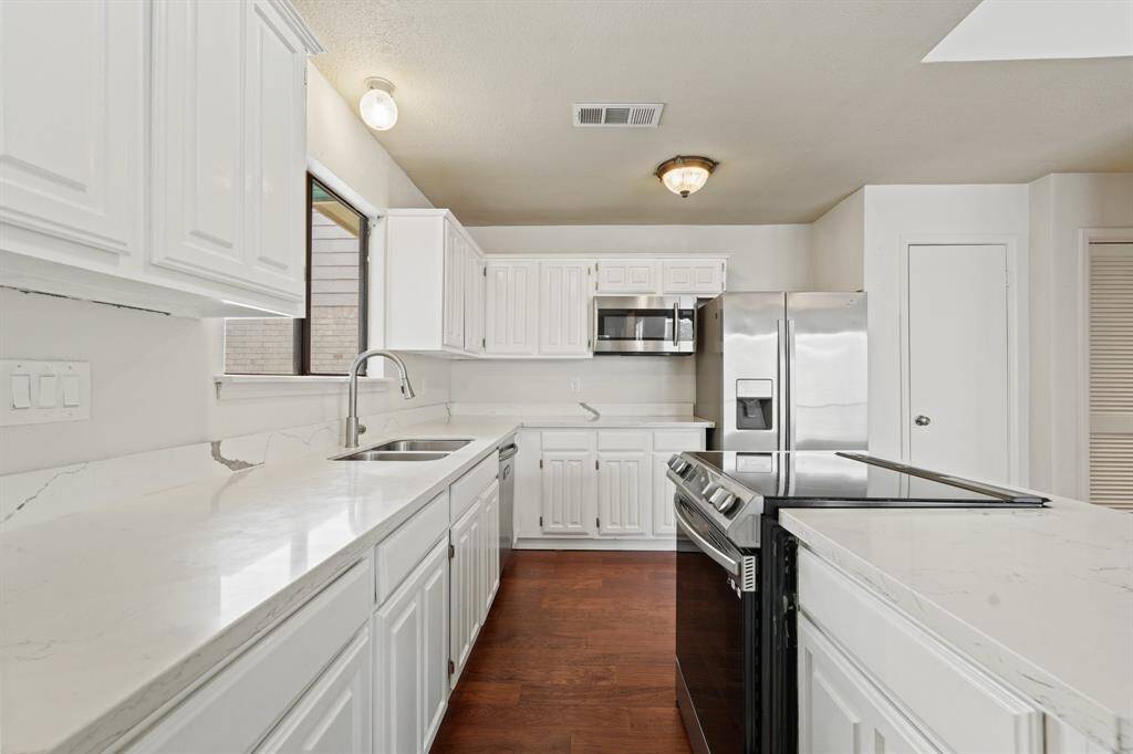 Host your next dinner party with confidence! This fully-equipped kitchen features a kitchen island, an abundance of cabinetry, TONS of counter space, granite countertops and stainless-steel appliances.