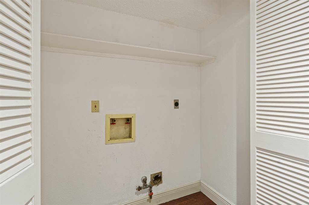 Tucked in nicely is this utility room with enough space to fit separate washer and dryer machines.