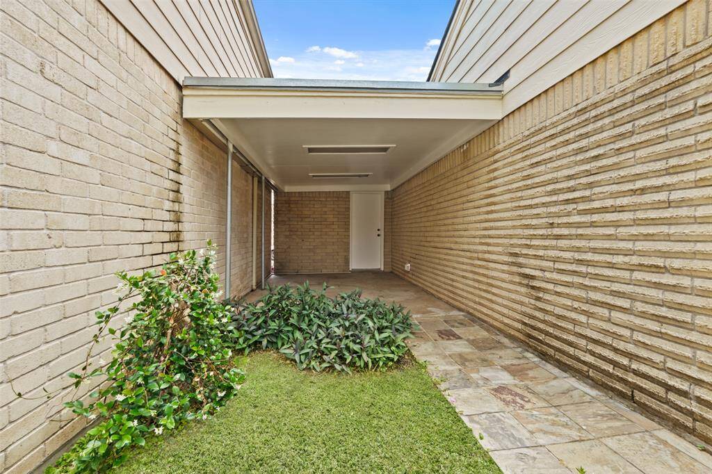 This covered walkway protects you from the rain when making your way to and from your patio.