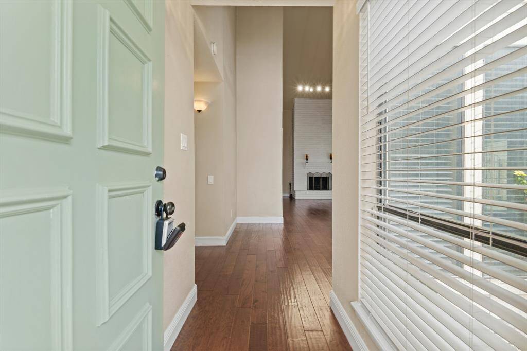 You'll be instantly greeted by beautiful hardwood floors, and a look straight into the living room.