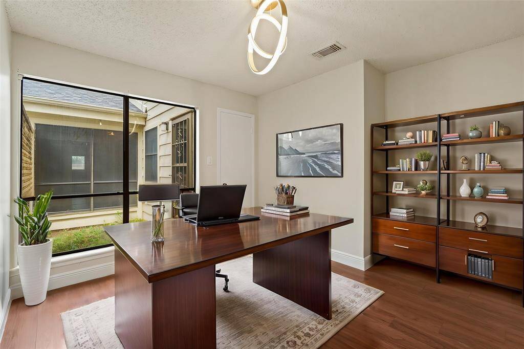 Virtually Staged: Check out this flex room that can easily become a stunning home office, or an additional bedroom. It features new hardwood floors, and a large window.