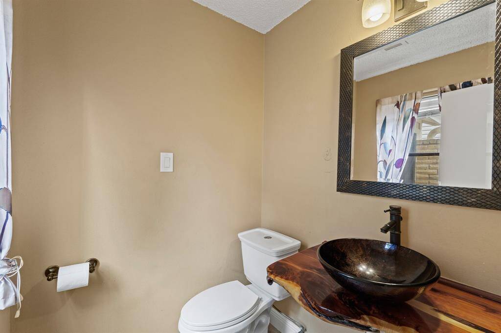 This well-appointed half bathroom is great for when you have family, friends, and guests over.