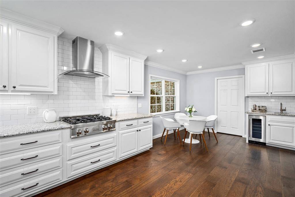 KITCHEN - Stainless appliances and a nearby wet bar including a wine fridge for easy entertaining.