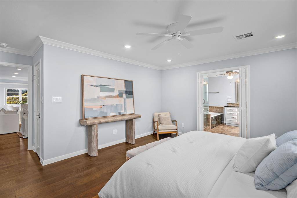 PRIMARY BEDROOM - Downstairs, the primary suite provides plenty of space and a huge walk-in closet.